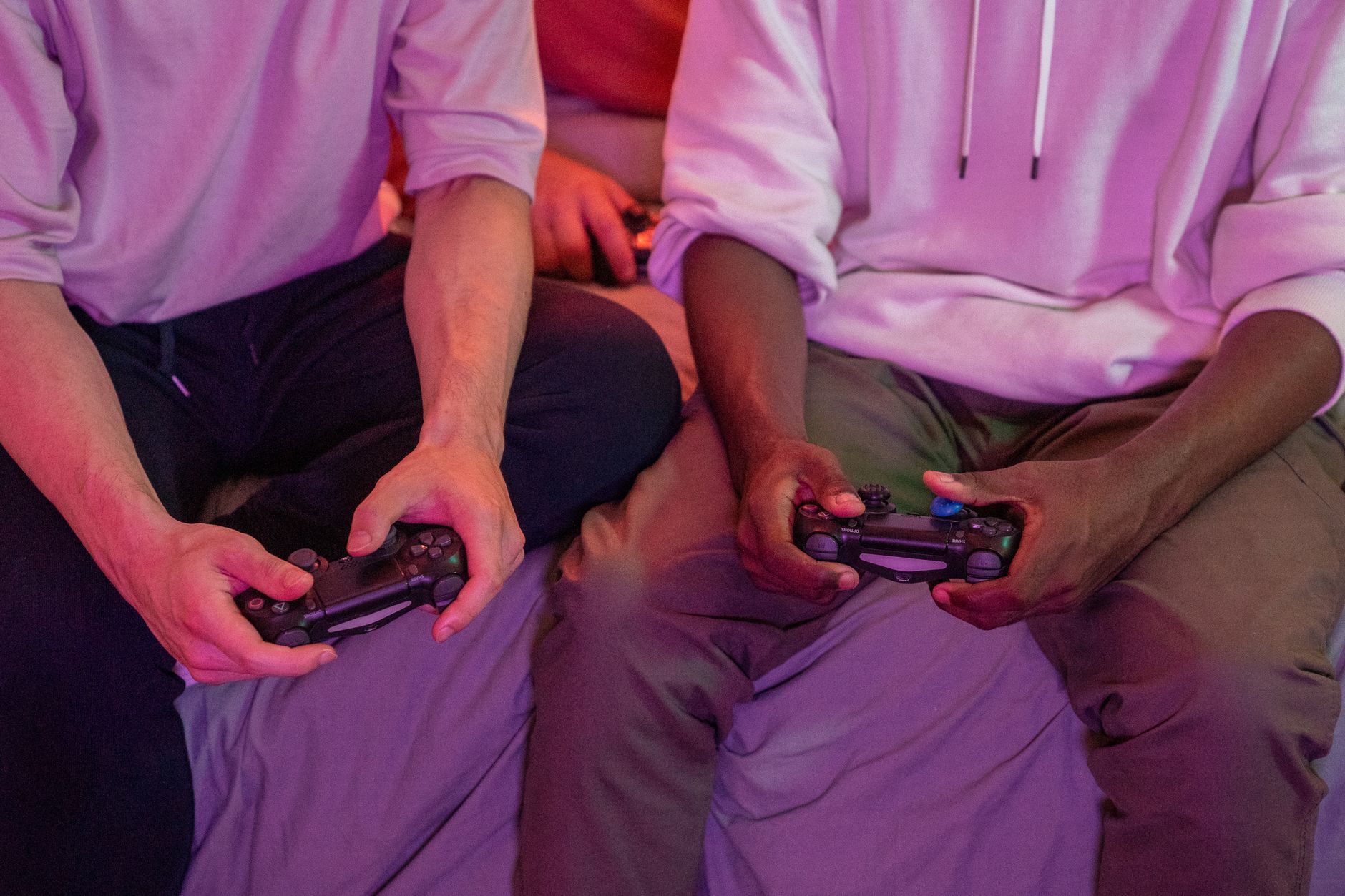 Two friends playing video games together at home, using controllers. — Brand New Casinos Let You Shape the Future of Play