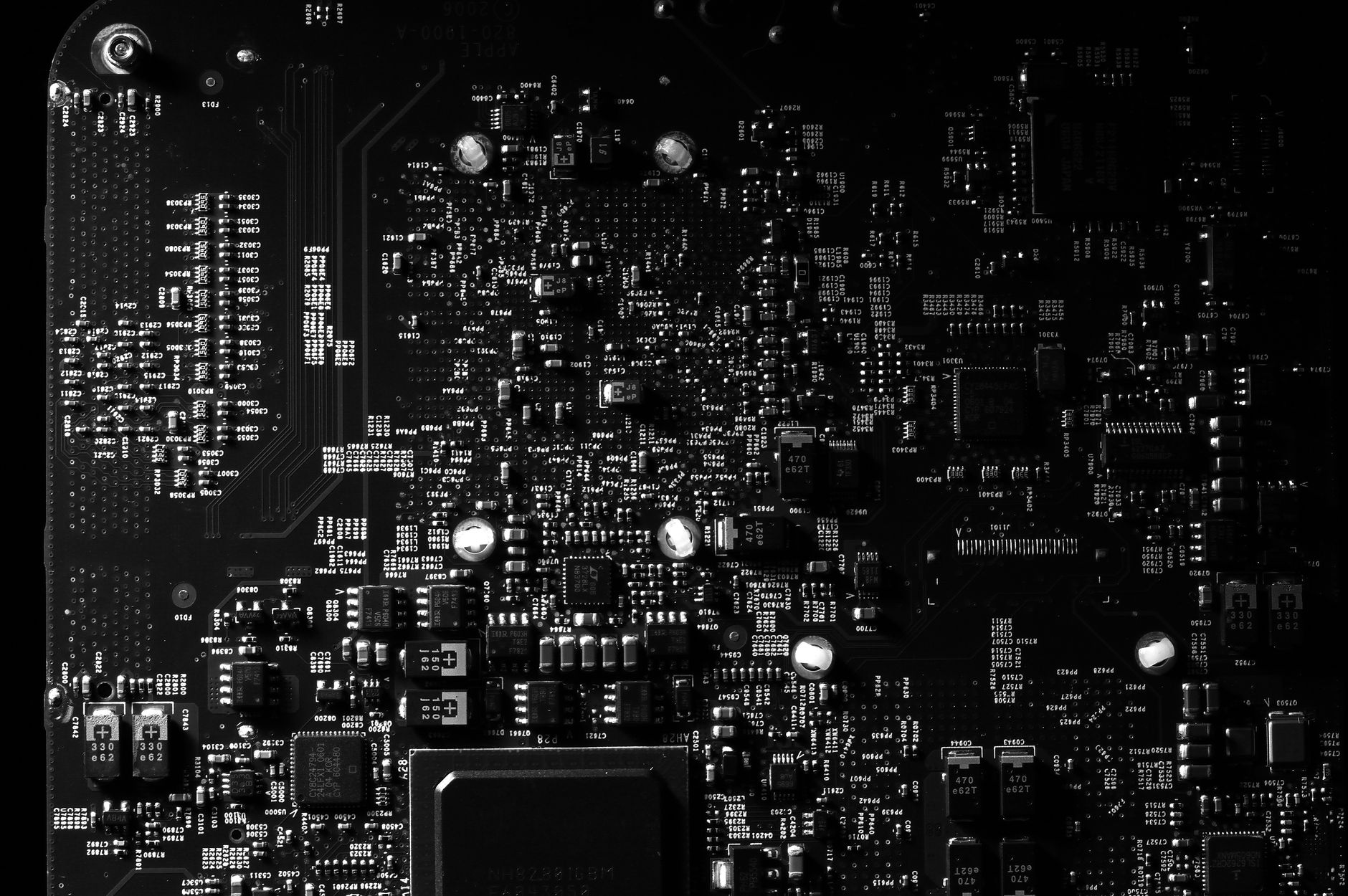 Detailed black and white photo of a circuit board showing intricate components, perfect for tech projects. — Great Discounts