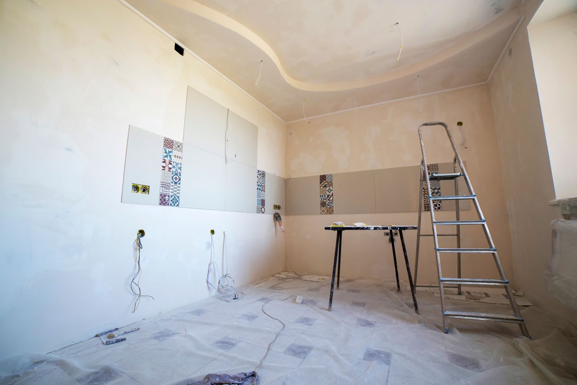 Interior view of a room under renovation with paint, tiles, and tools. — "Stylish and Energy-Efficient Windows for Doral Home